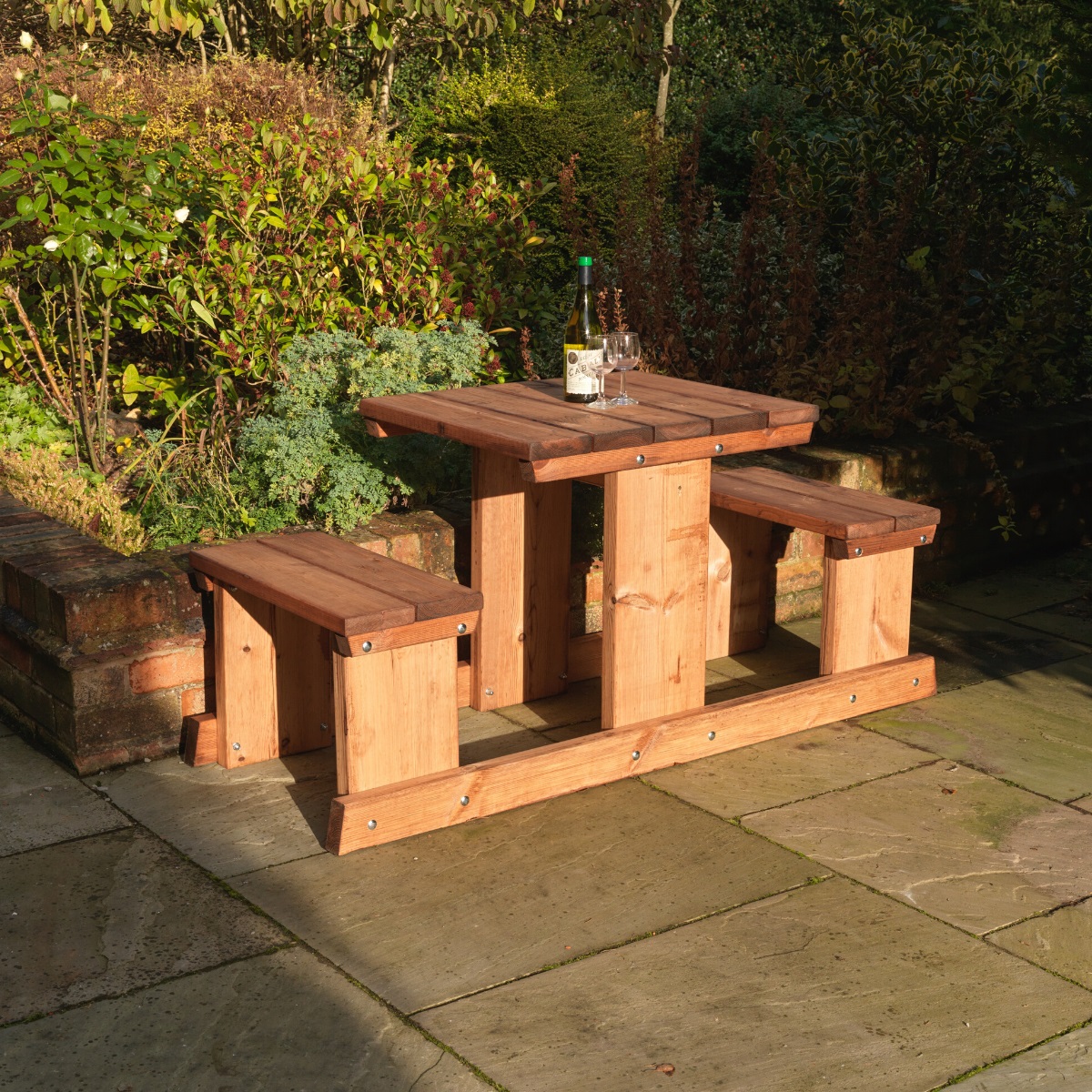 A sturdy wooden picnic table suitable for 2 people with rectangular table and two fixed benches