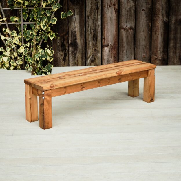 A chunky wooden outdoor backless bench seat