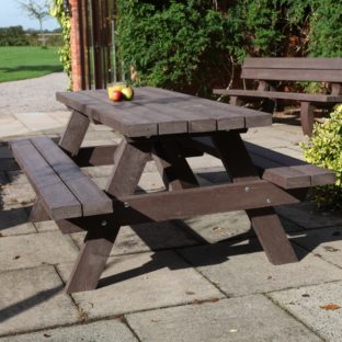 A brown recycled plastic A frame picnic table on a patio