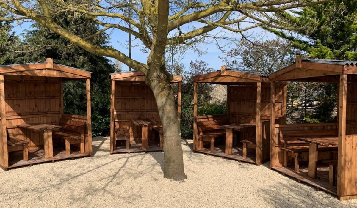 outdoor dining cabins in a pub garden